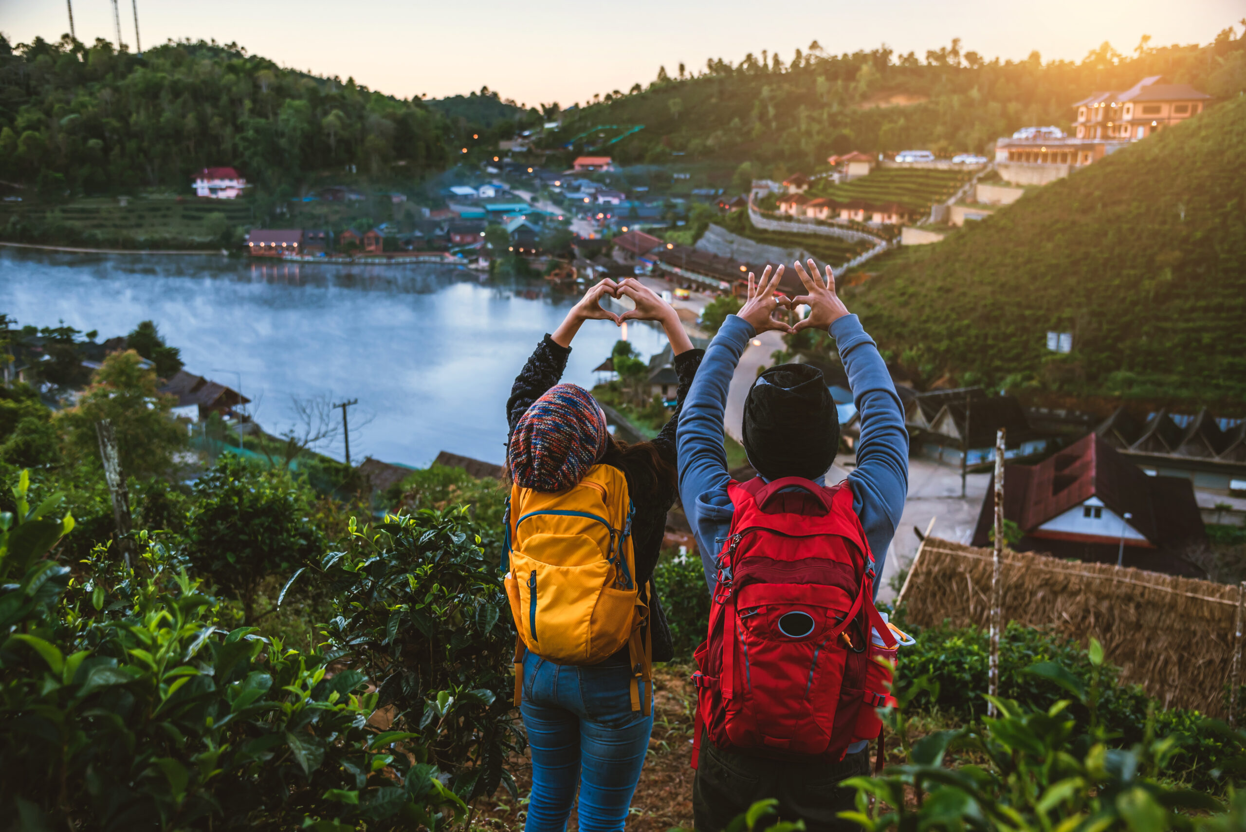 Couple Asian traveling together on mountain in Ban Rak Thai village countryside. Travel, camping in the winter, Outdoor relaxation, Romantic couples.