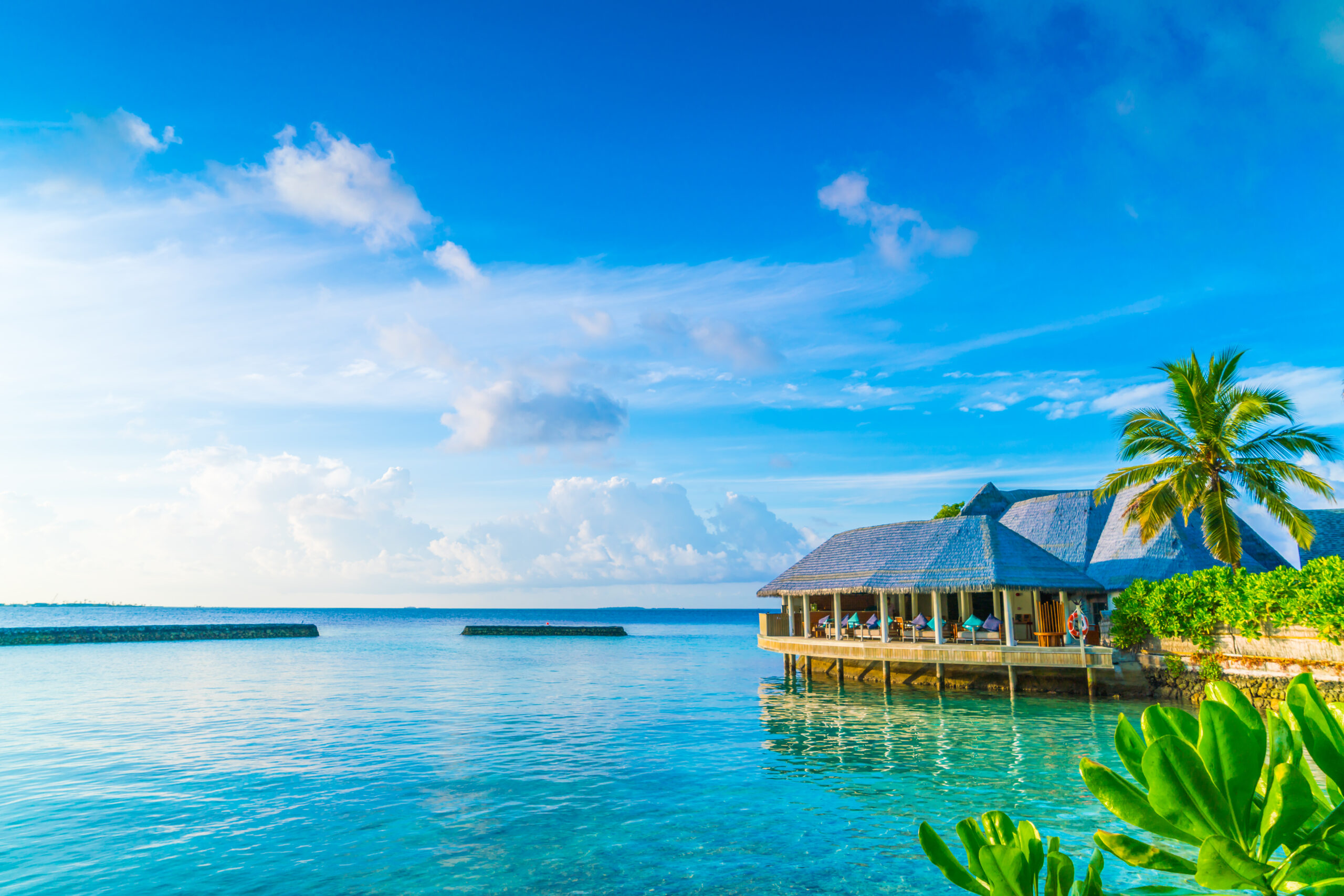 Beautiful water villas in tropical Maldives island at the sunrise time